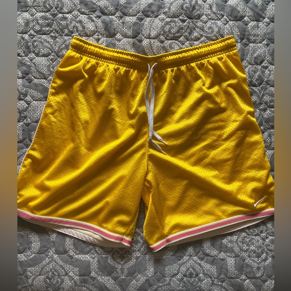 Bright yellow Nike basketball shorts